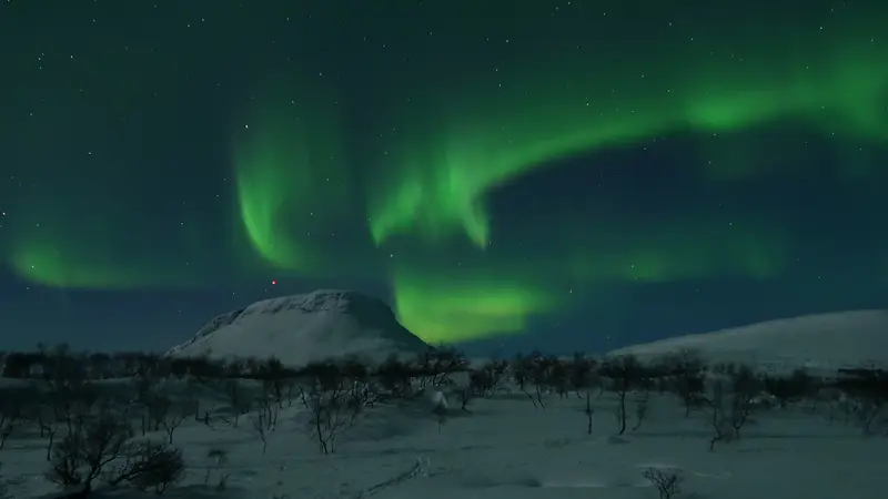 Green northern lights over Saana fell in Kilpisjärvi, Finnish Lapland
